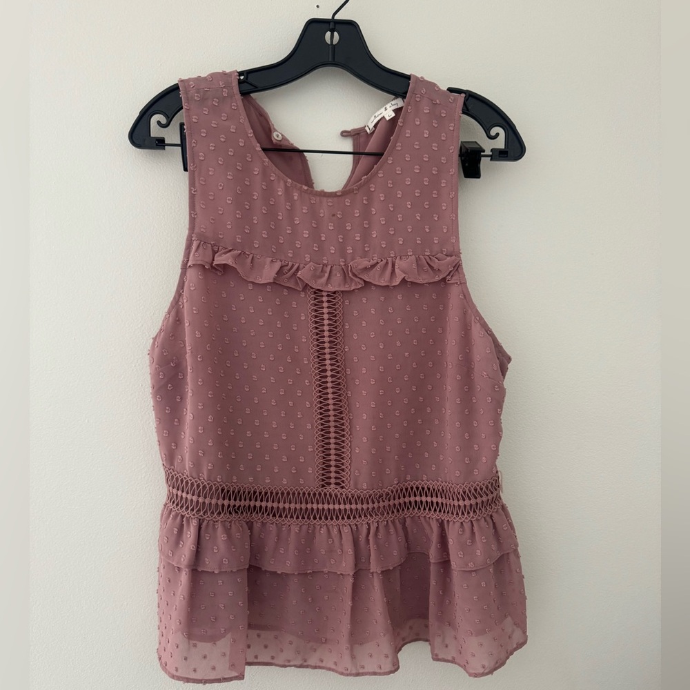 Pink polka dot Willow & Clay blouse with ruffled hem.